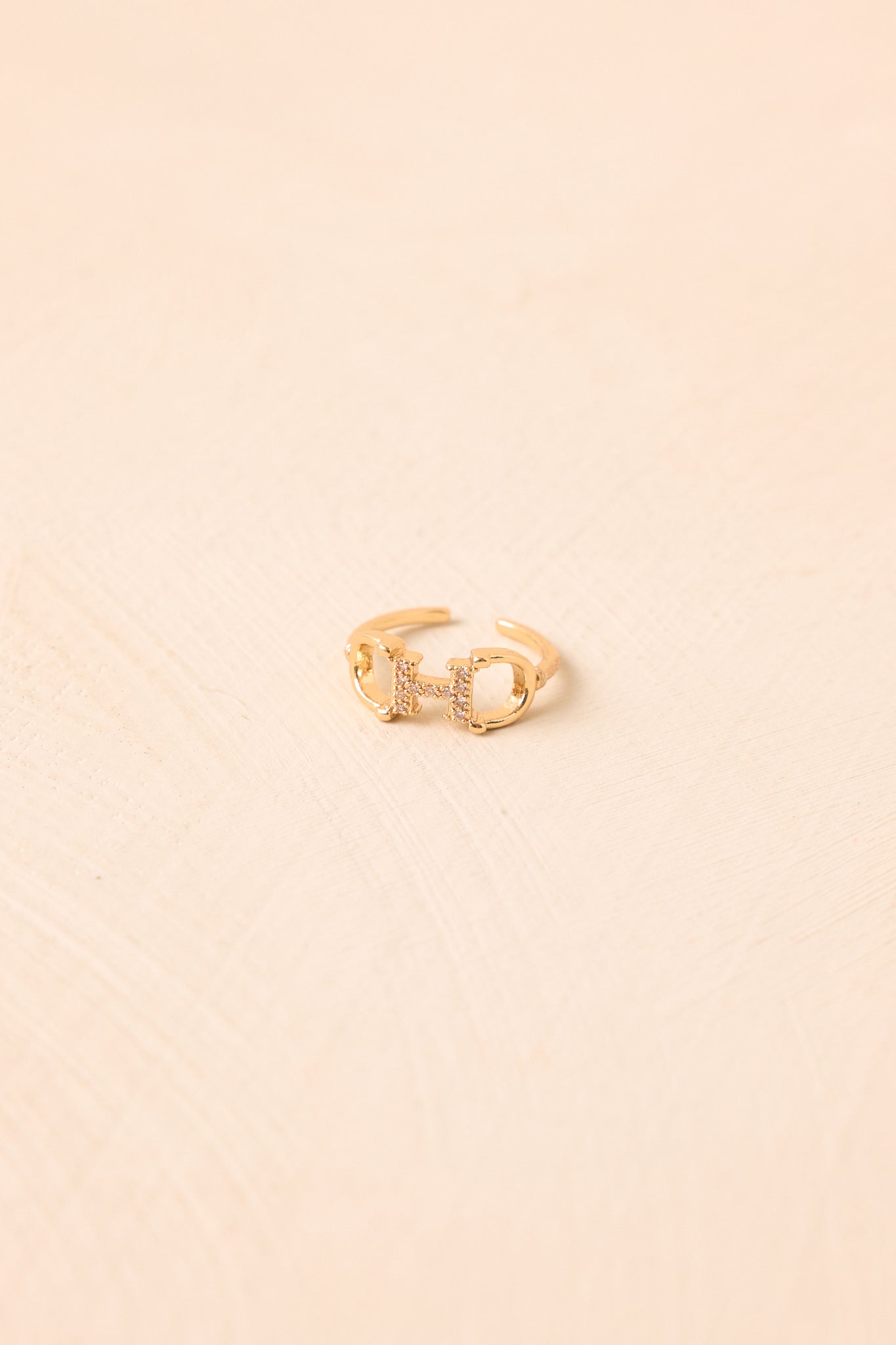 A Winning Detail Gold Crystal Horsebit Ring